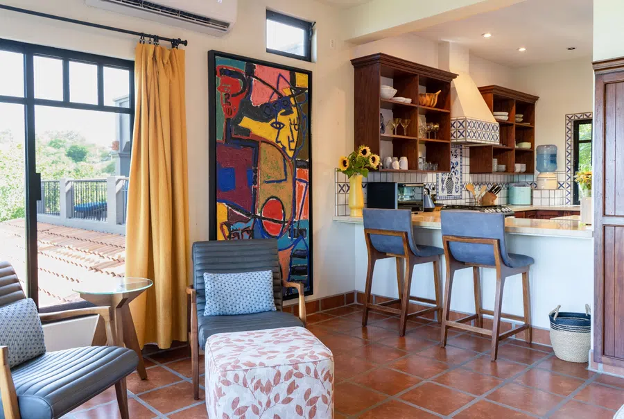A bright sitting area connects directly to the kitchen and breakfast bar.