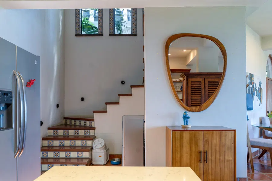 View from the kitchen toward the staircase leading to 3rd floor master bedroom, bathroom, and balcony