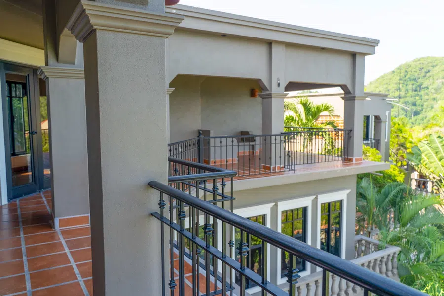 3rd floor balcony wraps around the residence and opens toward the surrounding hills and ocean.