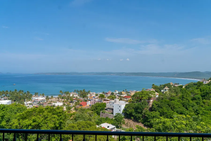 Wide 3rd floor west-facing view over La Manzanilla and the sweeping bay.