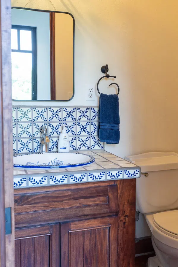 Compact guest bathroom next to guest bedroom/exercise room
