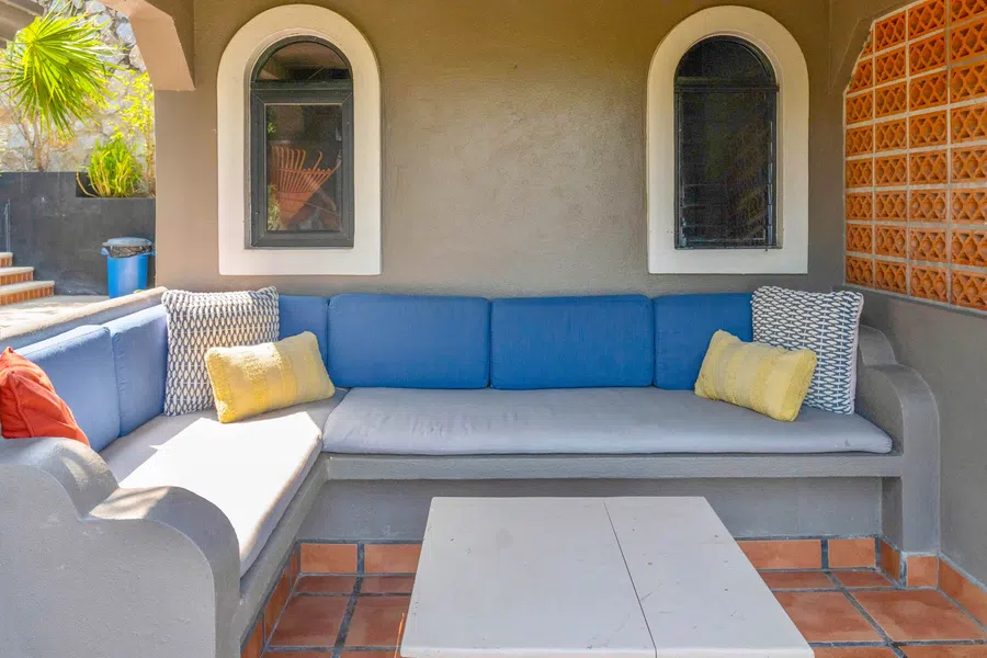 Built-in seating creates a protected gathering area near the casitas