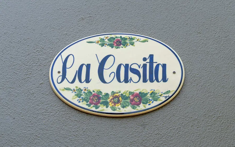 Hand-painted plaque marks one of the property's independent casitas.